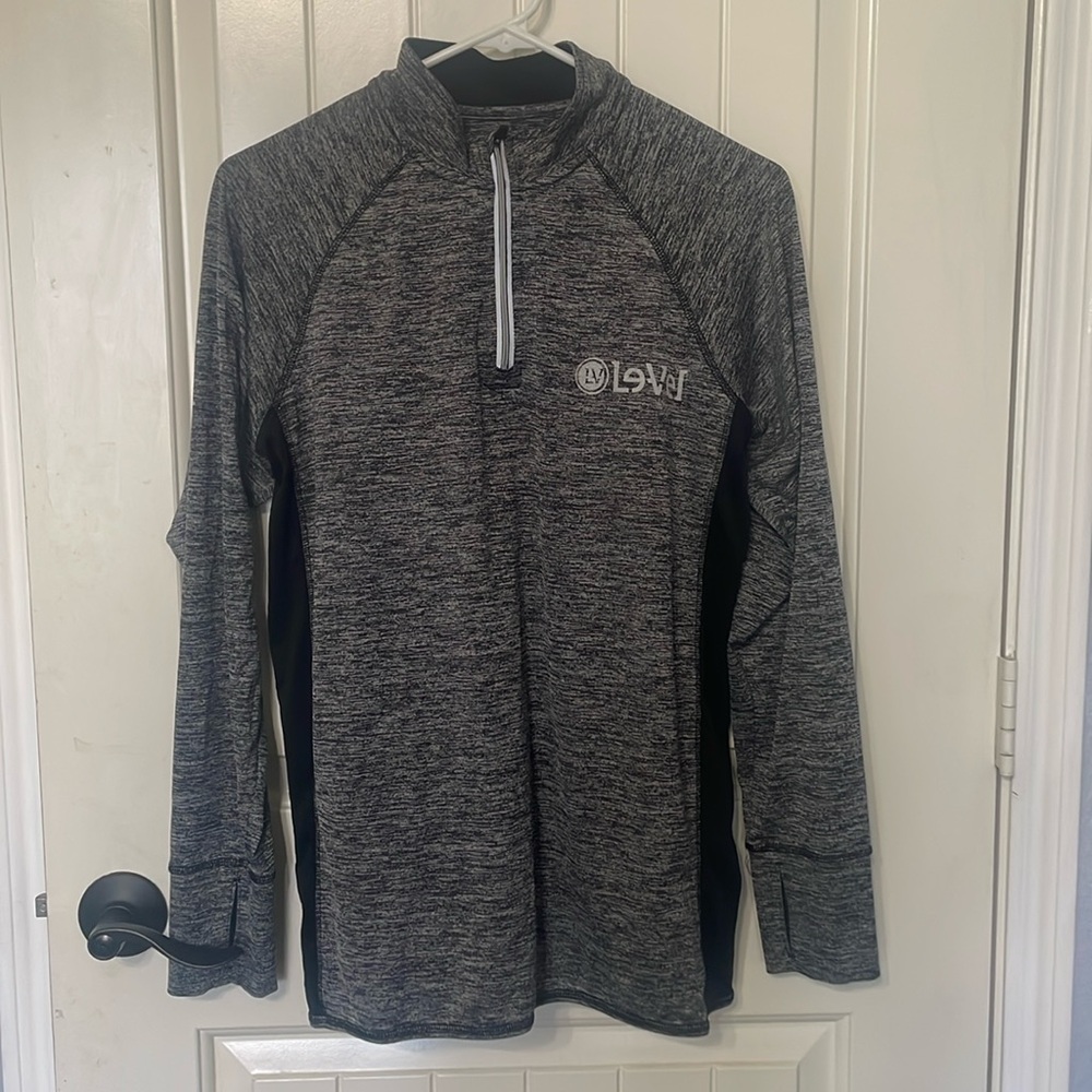 Men’s “Le-Vel by Thrive … polyester long sleeve shirt.